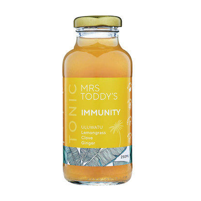  Bottle of Mrs. Toddy’s Immunity Tonic with real turmeric, ginger, tamarind, and lemon on a neutral background