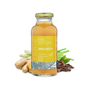 Mrs. Toddy’s Immunity Tonic bottle photographed with fresh turmeric, ginger and lemon. All-natural, plant-based health tonic